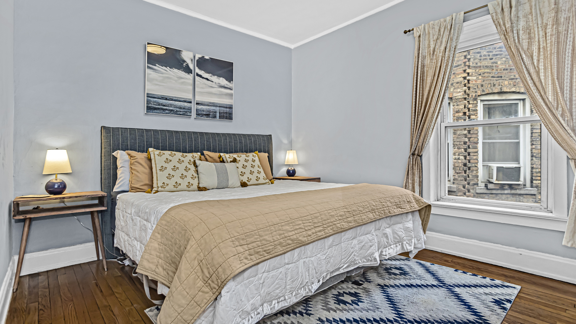 322 Main Street, Unit 2 Evanston, IL 60202 - Photo 9 of 15 a bedroom with a bed and a window