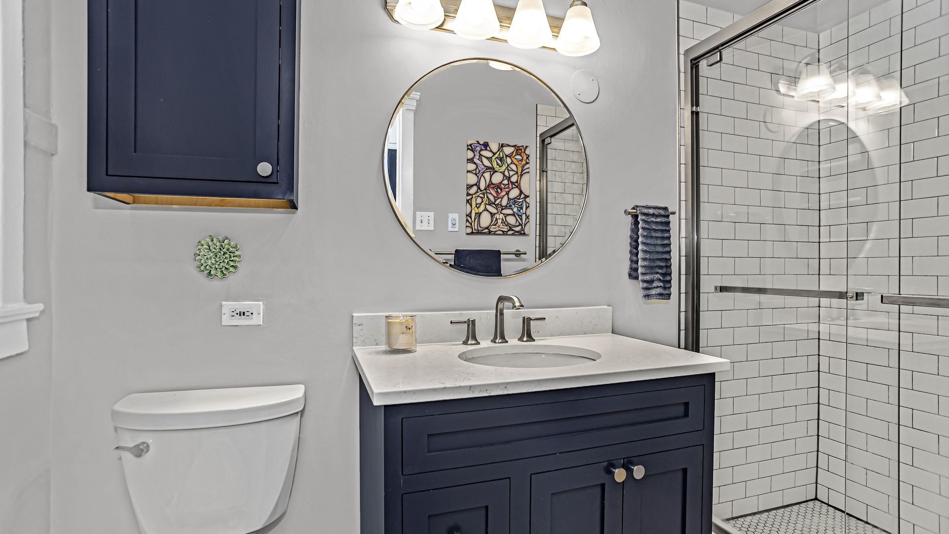 322 Main Street, Unit 2 Evanston, IL 60202 - Photo 10 of 15 a bathroom with a sink a mirror and a toilet