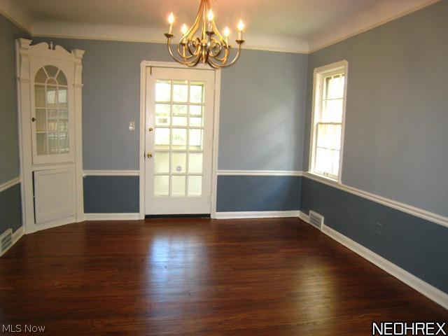 3541 Lytle Road Beachwood, OH 44122 - Photo 4 of 20 Formal dining room with refinished wood floors, chair rail molding, corner cabinet and door leading to enclosed porch.