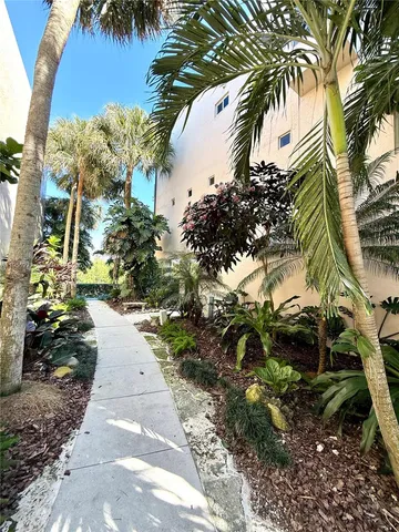 a view of a chairs and table in patio