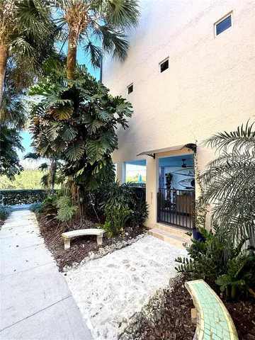 a view of a living room and floor to ceiling window or wooden floor