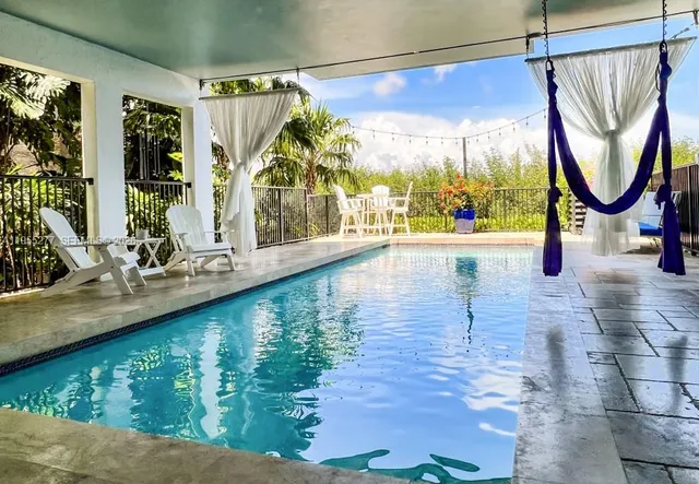 a view of a lake with a house in the background