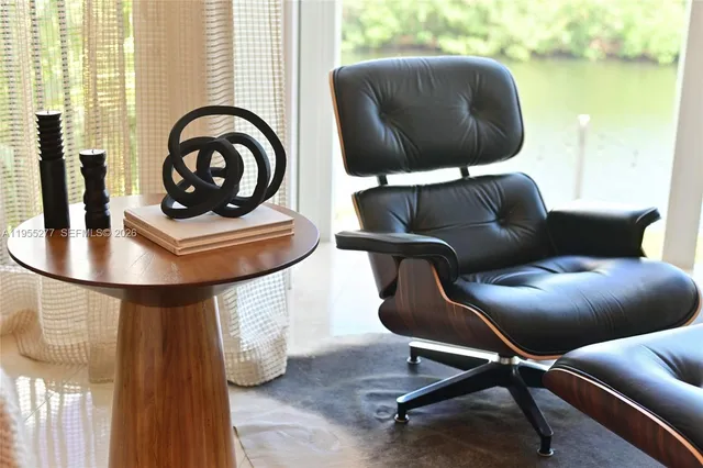 a dining room with furniture and chandelier