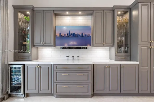 a living room with furniture and a book shelf