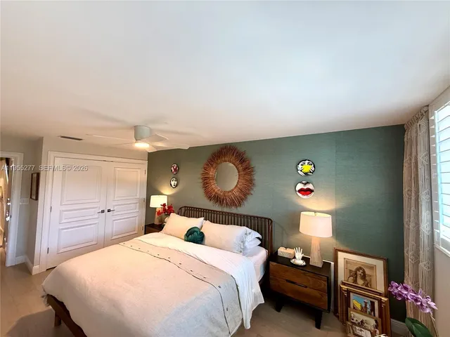 a view of a ocean with a palm tree