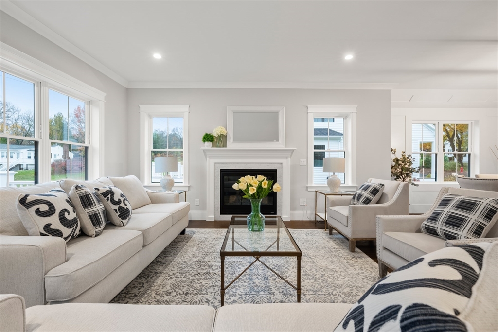 16 Wayside Road, Unit 14 Natick, MA 01760 - Photo 11 of 42 a living room with furniture and a fireplace