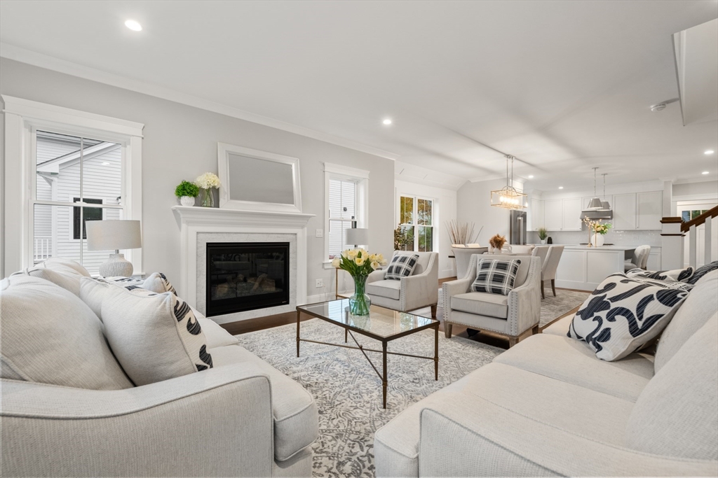 16 Wayside Road, Unit 14 Natick, MA 01760 - Photo 12 of 42 a living room with furniture a fireplace and a table