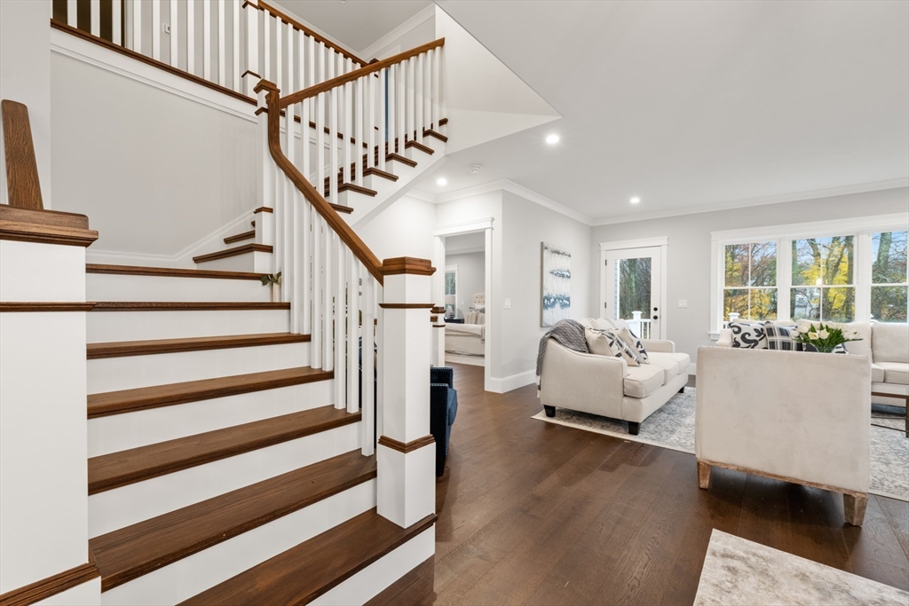 16 Wayside Road, Unit 14 Natick, MA 01760 - Photo 24 of 42 a living room with furniture and stairs