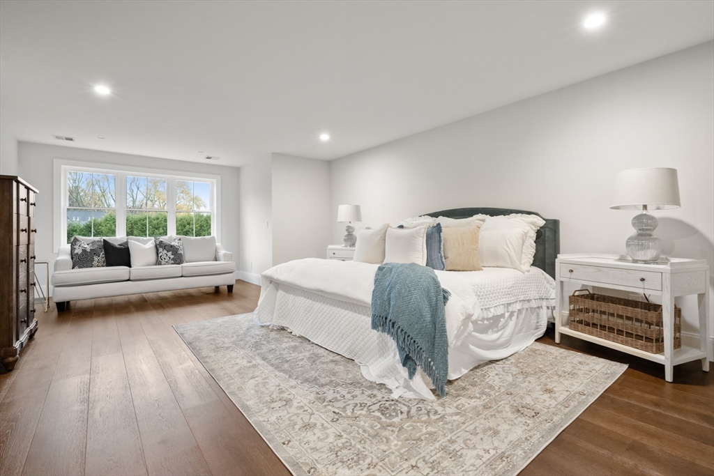 16 Wayside Road, Unit 14 Natick, MA 01760 - Photo 28 of 42 a bedroom with a bed and a couch