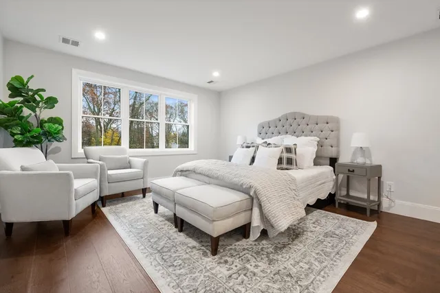 a bedroom with a bed and a couch