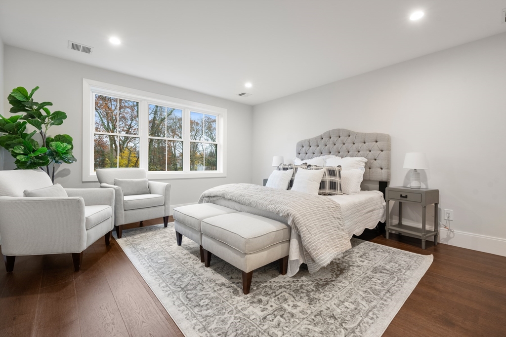 16 Wayside Road, Unit 14 Natick, MA 01760 - Photo 31 of 42 a bedroom with a bed and a couch