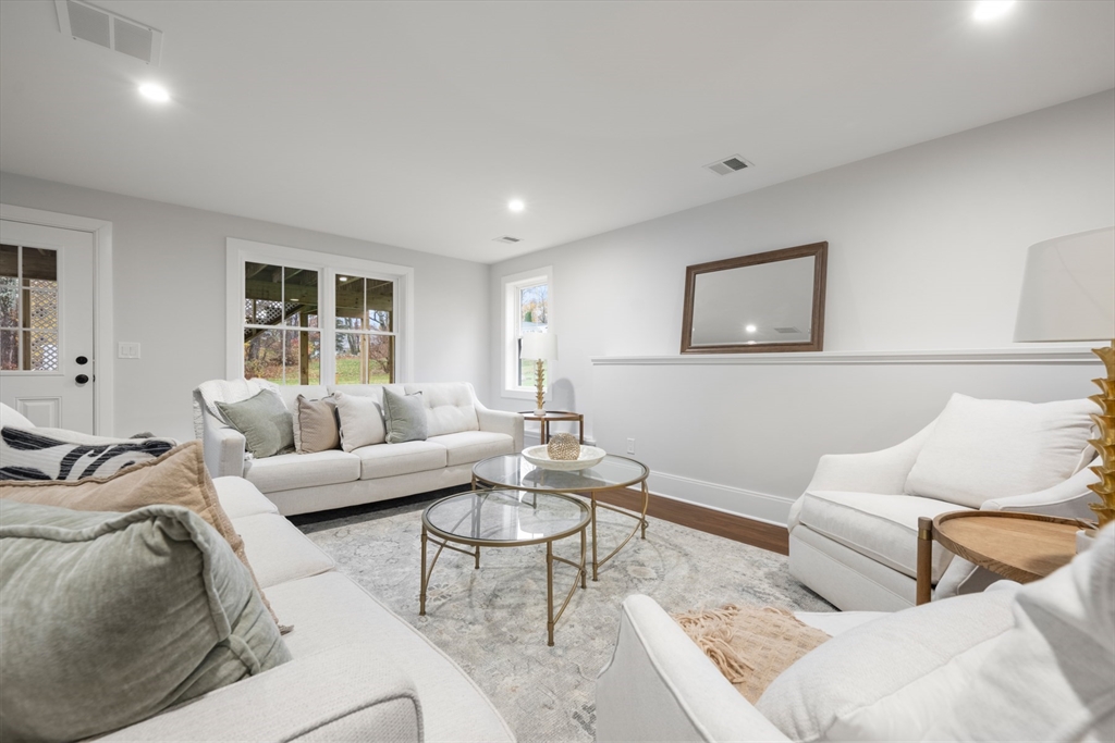 16 Wayside Road, Unit 14 Natick, MA 01760 - Photo 37 of 42 a living room with furniture and a couch