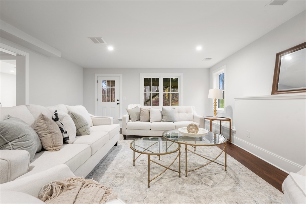 16 Wayside Road, Unit 14 Natick, MA 01760 - Photo 38 of 42 a living room with furniture and wooden floor