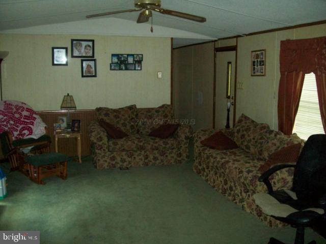 9163 Green Branch Road Willards, MD 21874 - Photo 3 of 6 a living room with furniture and a bed