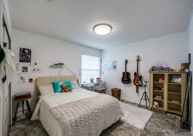 a bedroom with a bed and closet