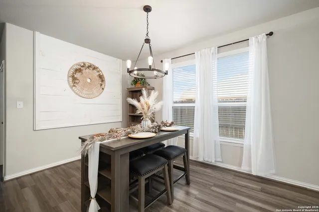 a view of a dining room with furniture window and wooden floor