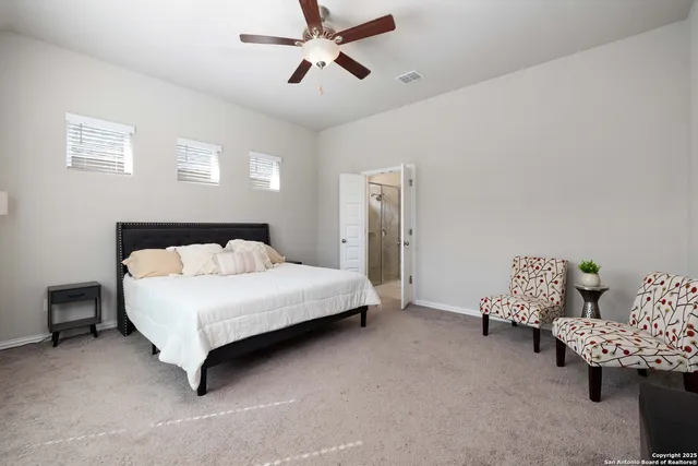 a bedroom with a bed and furniture