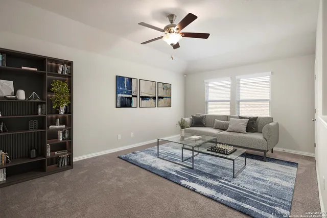 a living room with furniture and a window