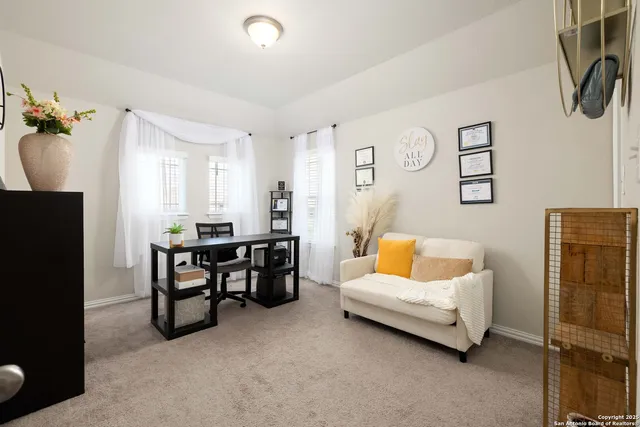 a living room with furniture and a table