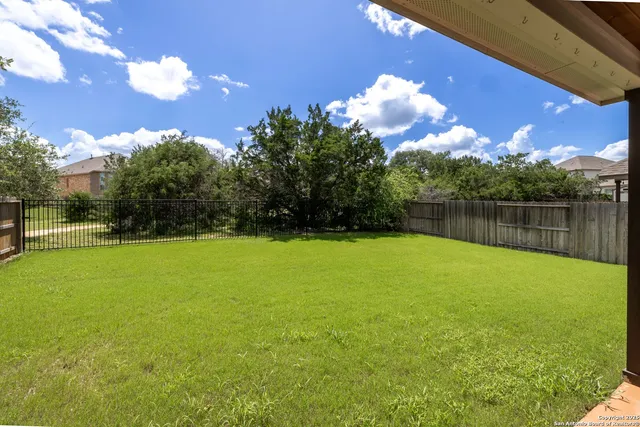 a view of a garden and basketball court