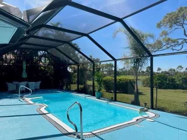 a view of a backyard with swimming pool