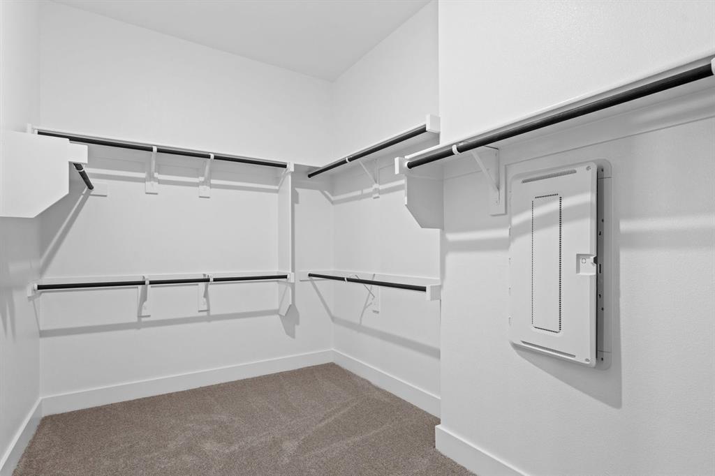 1792 Monarch Way Oak Point, TX 75068 - Photo 19 of 26 a view of an empty walk in closet