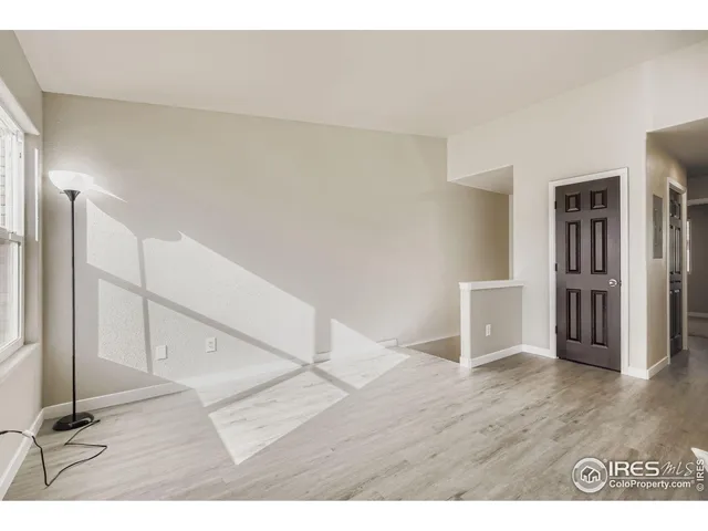 a view of a kitchen with wooden floor