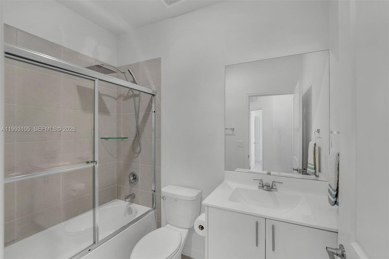 2425 Southeast 28th Drive, Unit 2425 Homestead, FL 33035 - Photo 13 of 98 a bathroom with a sink toilet vanity and shower