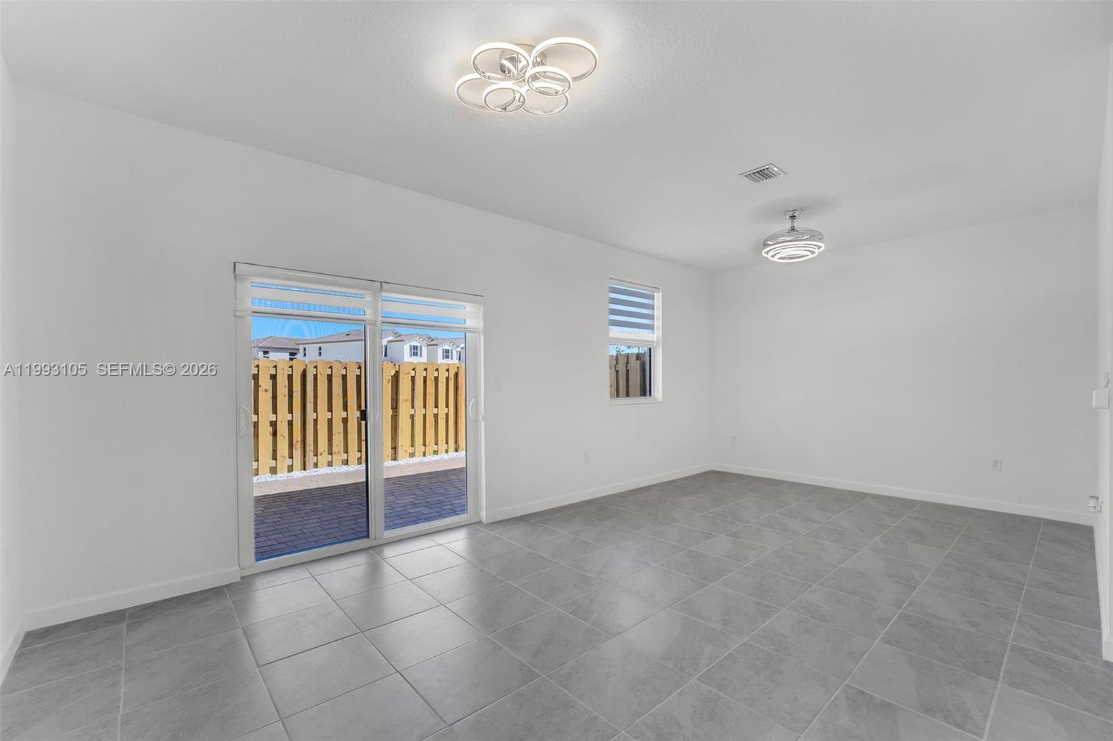 2425 Southeast 28th Drive, Unit 2425 Homestead, FL 33035 - Photo 18 of 98 an empty room with windows