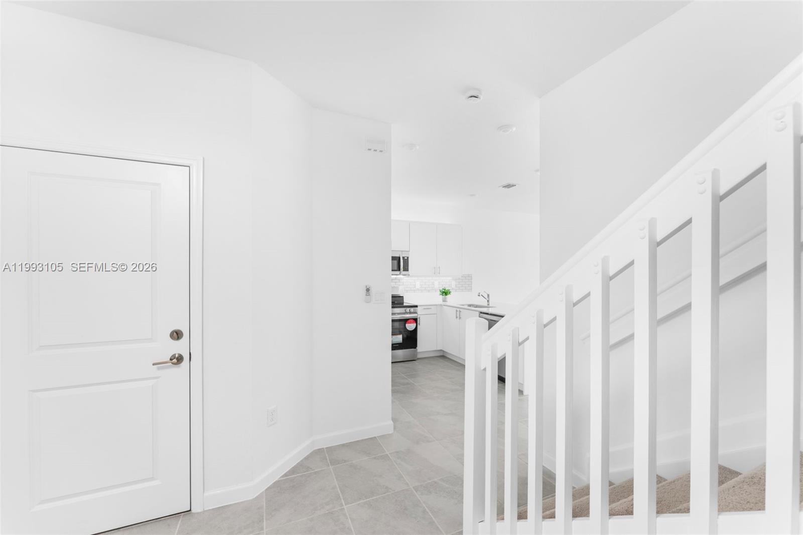 2425 Southeast 28th Drive, Unit 2425 Homestead, FL 33035 - Photo 23 of 98 a view of a livingroom with stairs