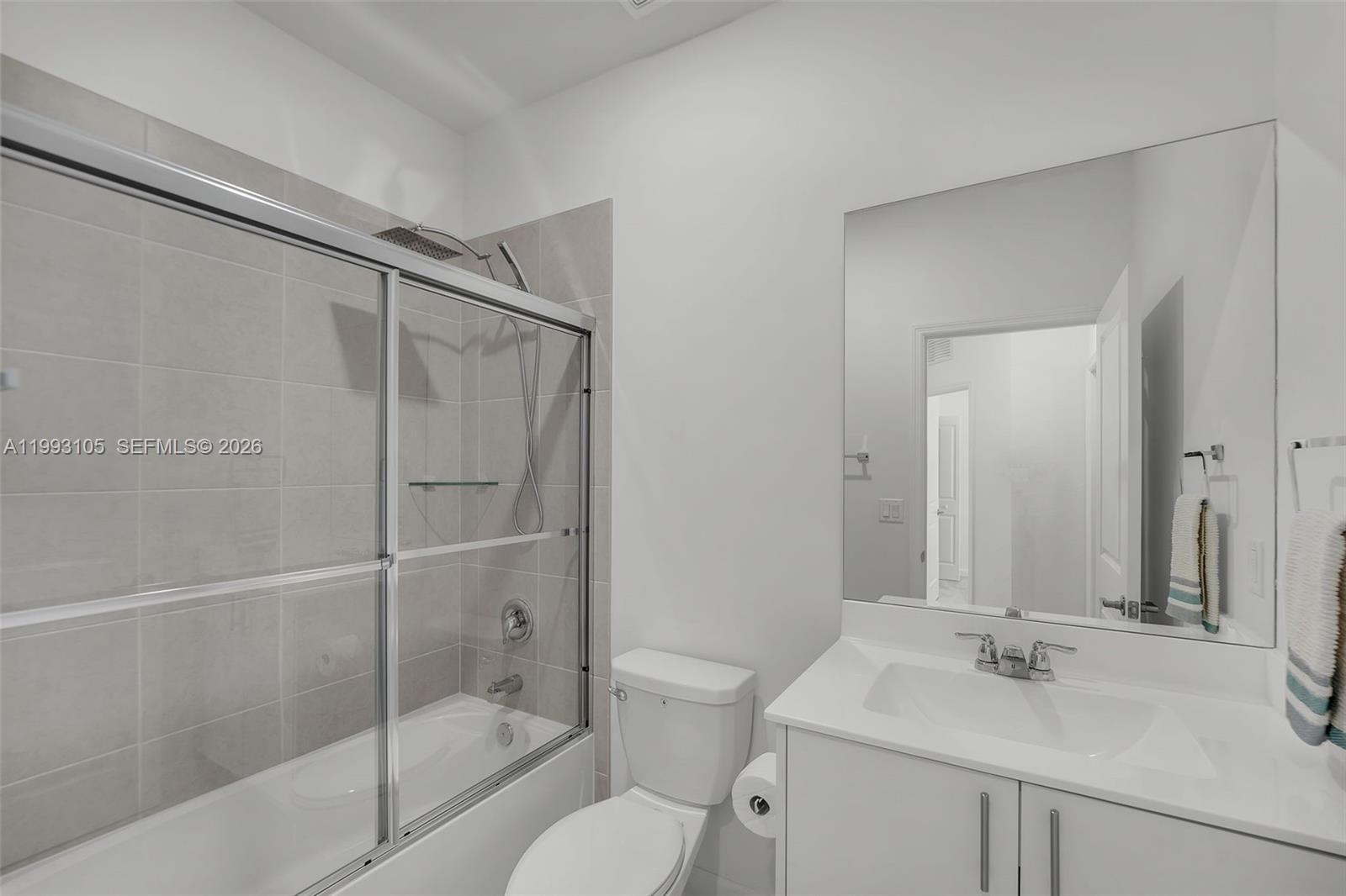 2425 Southeast 28th Drive, Unit 2425 Homestead, FL 33035 - Photo 31 of 98 a bathroom with a sink toilet and shower