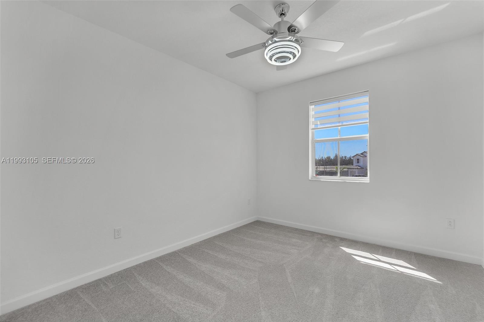 2425 Southeast 28th Drive, Unit 2425 Homestead, FL 33035 - Photo 34 of 98 an empty room with a fan