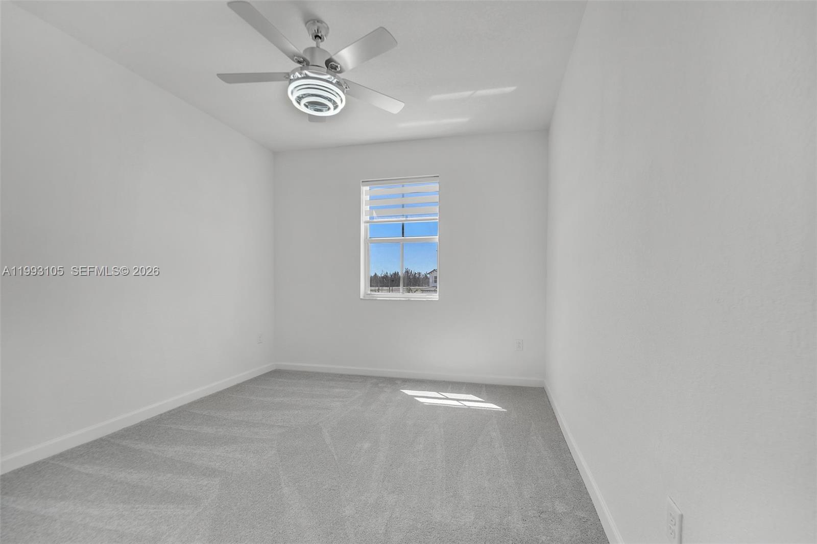 2425 Southeast 28th Drive, Unit 2425 Homestead, FL 33035 - Photo 35 of 98 an empty room with a window