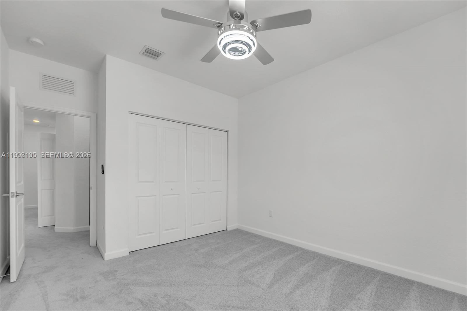 2425 Southeast 28th Drive, Unit 2425 Homestead, FL 33035 - Photo 37 of 98 an empty room with kitchen and a ceiling fan