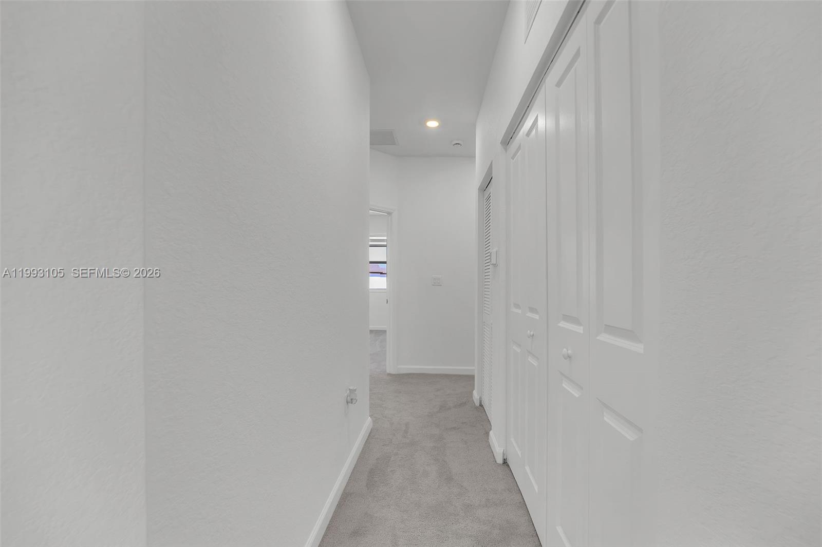 2425 Southeast 28th Drive, Unit 2425 Homestead, FL 33035 - Photo 40 of 98 a view of a hallway with wooden floor