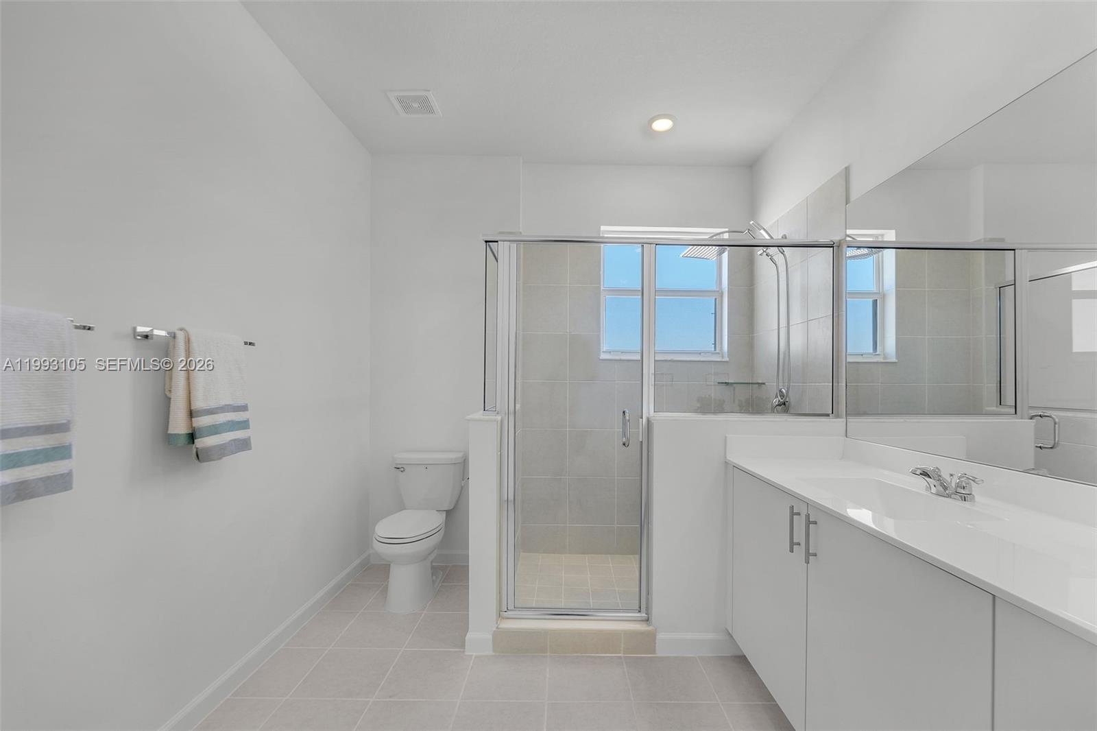 2425 Southeast 28th Drive, Unit 2425 Homestead, FL 33035 - Photo 47 of 98 a bathroom with a sink a toilet and shower