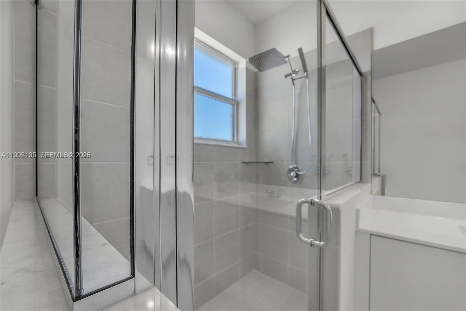 2425 Southeast 28th Drive, Unit 2425 Homestead, FL 33035 - Photo 48 of 98 a bathroom with a shower and a mirror
