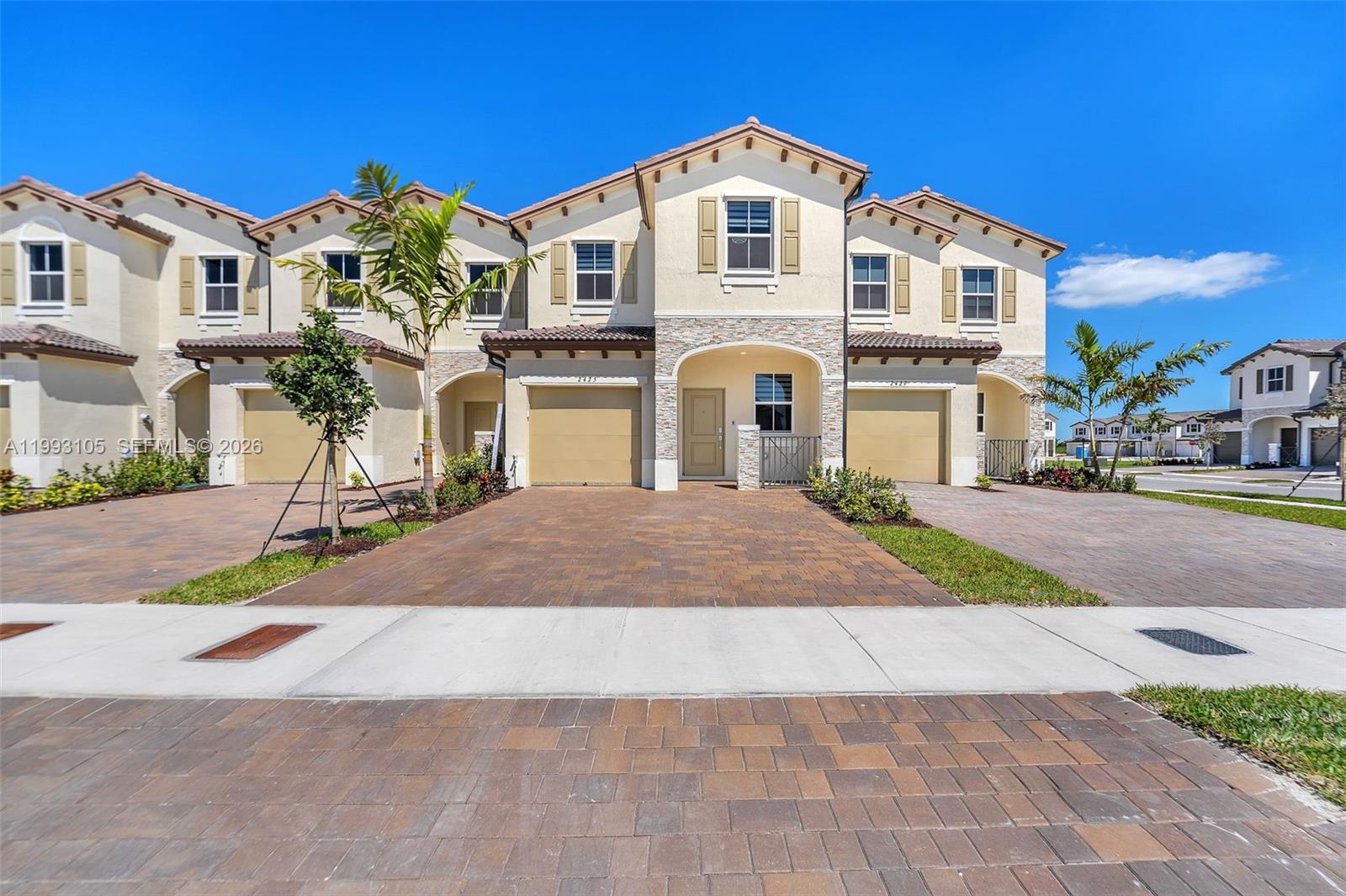 2425 Southeast 28th Drive, Unit 2425 Homestead, FL 33035 - Photo 61 of 98 a front view of a building with a yard