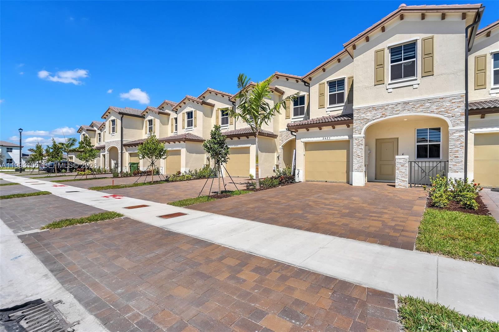 2425 Southeast 28th Drive, Unit 2425 Homestead, FL 33035 - Photo 64 of 98 a front view of a house with a yard