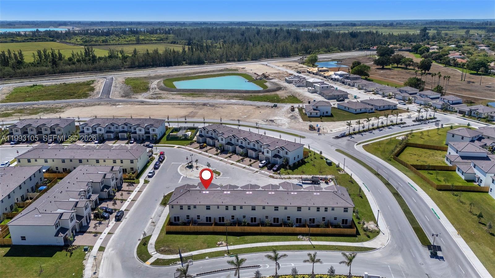 2425 Southeast 28th Drive, Unit 2425 Homestead, FL 33035 - Photo 78 of 98 a view of a swimming pool with a yard and lake view