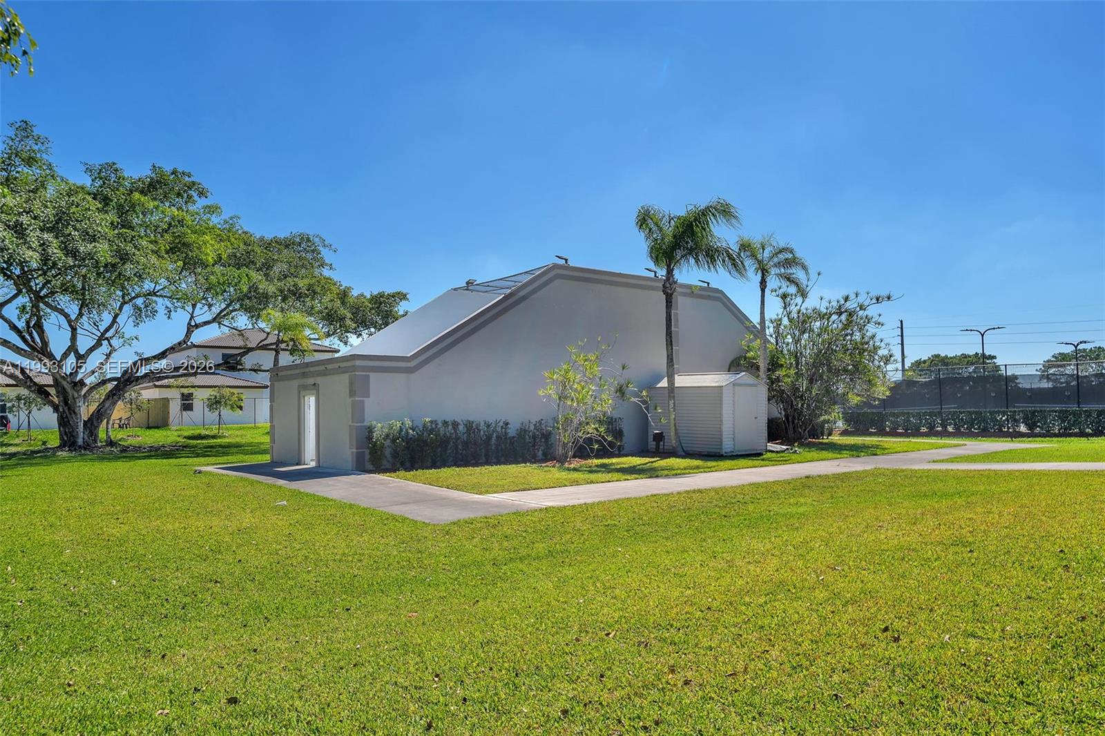 2425 Southeast 28th Drive, Unit 2425 Homestead, FL 33035 - Photo 84 of 98 a house view with swimming pool in front of it