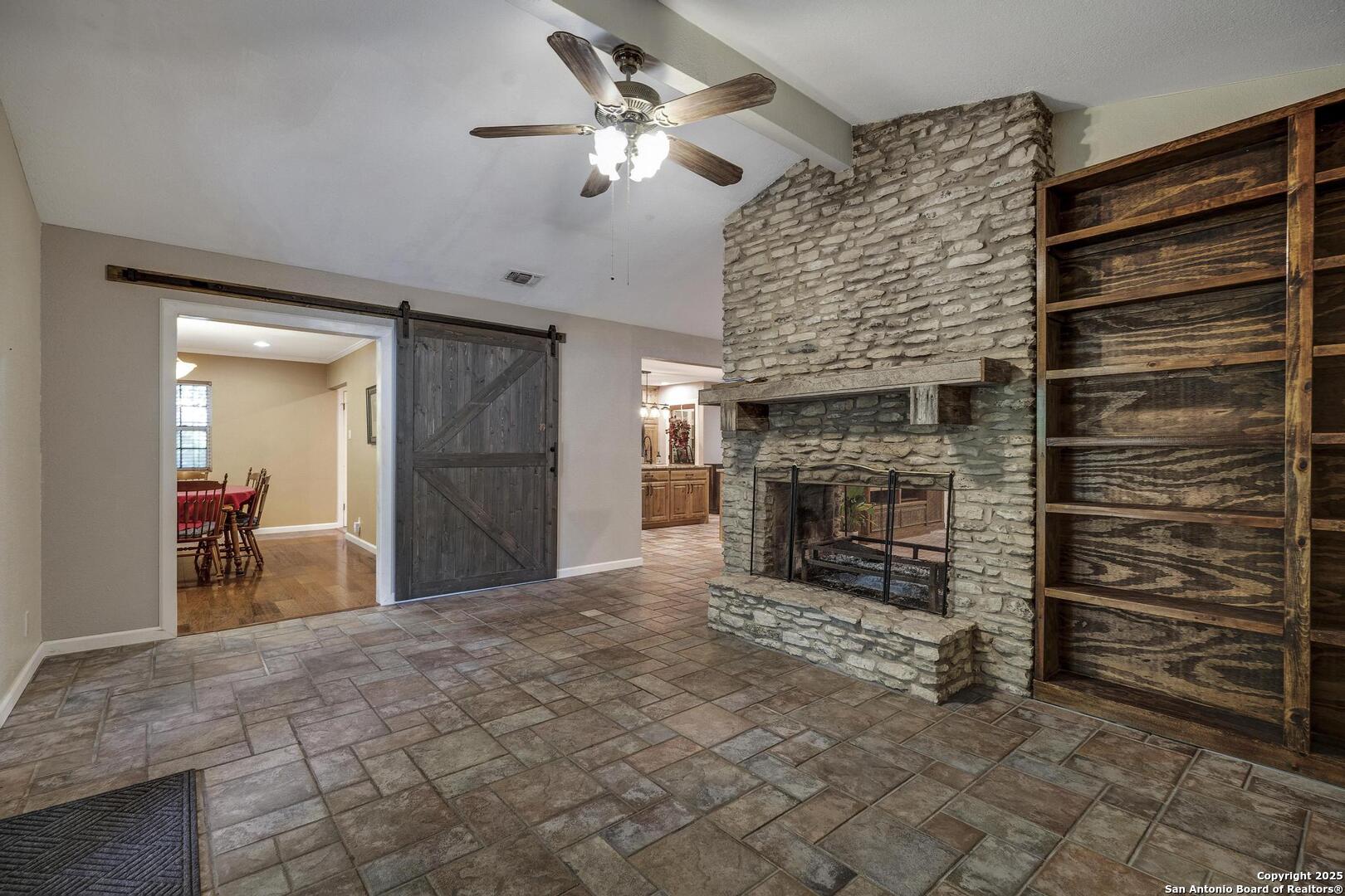 10855 Jericho Road Helotes, TX 78023 - Photo 22 of 59 a view of a livingroom with a fireplace