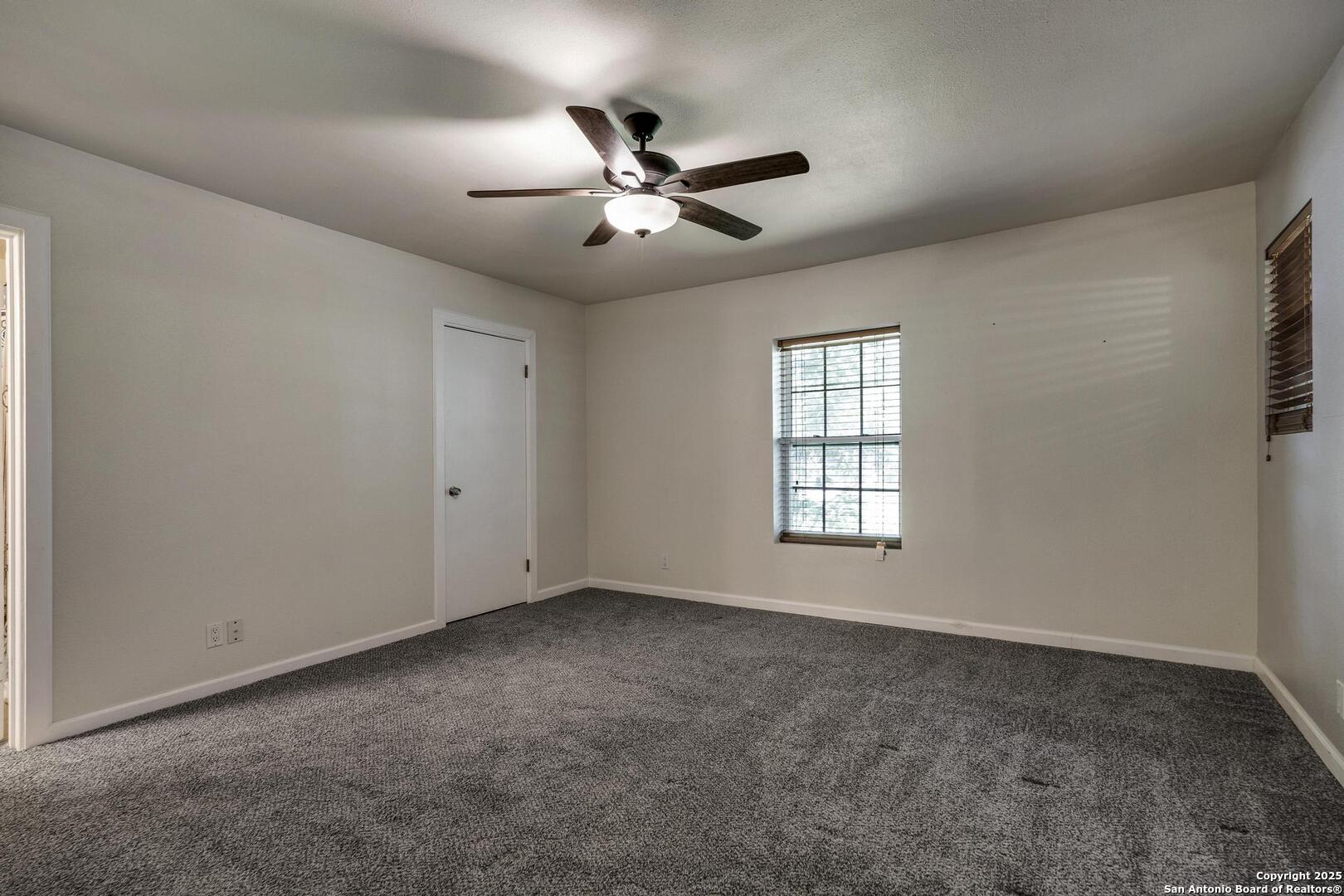 10855 Jericho Road Helotes, TX 78023 - Photo 28 of 59 a view of an empty room with a window