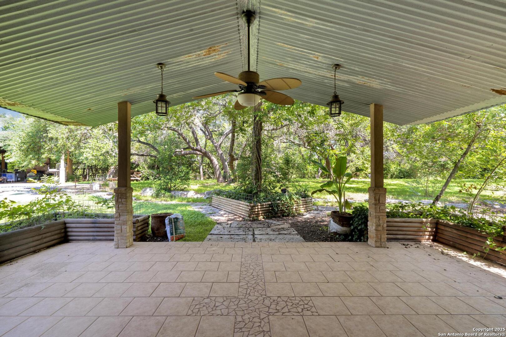 10855 Jericho Road Helotes, TX 78023 - Photo 38 of 59 a backyard of a house with seating space