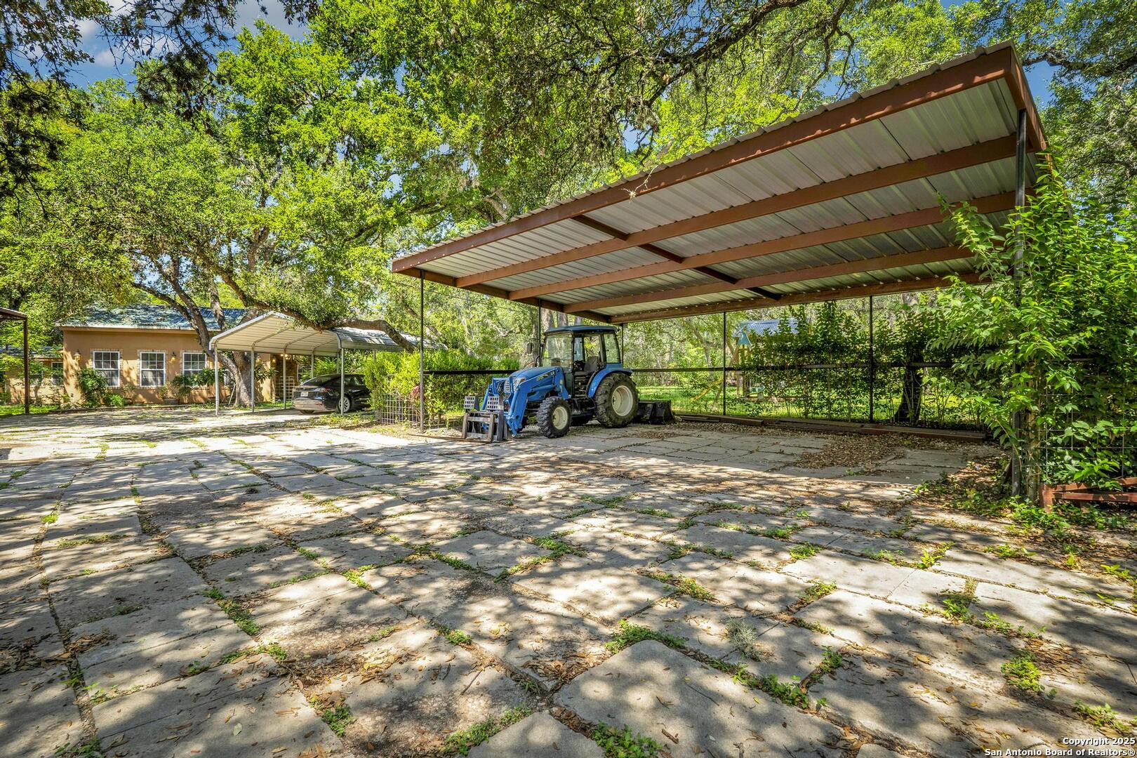 10855 Jericho Road Helotes, TX 78023 - Photo 49 of 59 a view of outdoor space with deck and tree