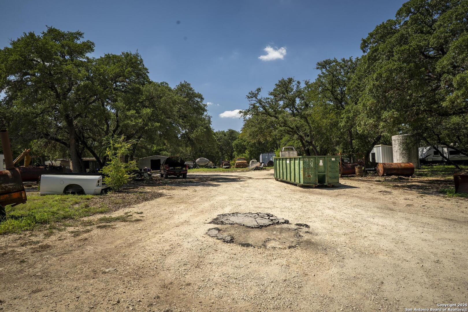 10855 Jericho Road Helotes, TX 78023 - Photo 55 of 59 a view of a yard with plants and trees