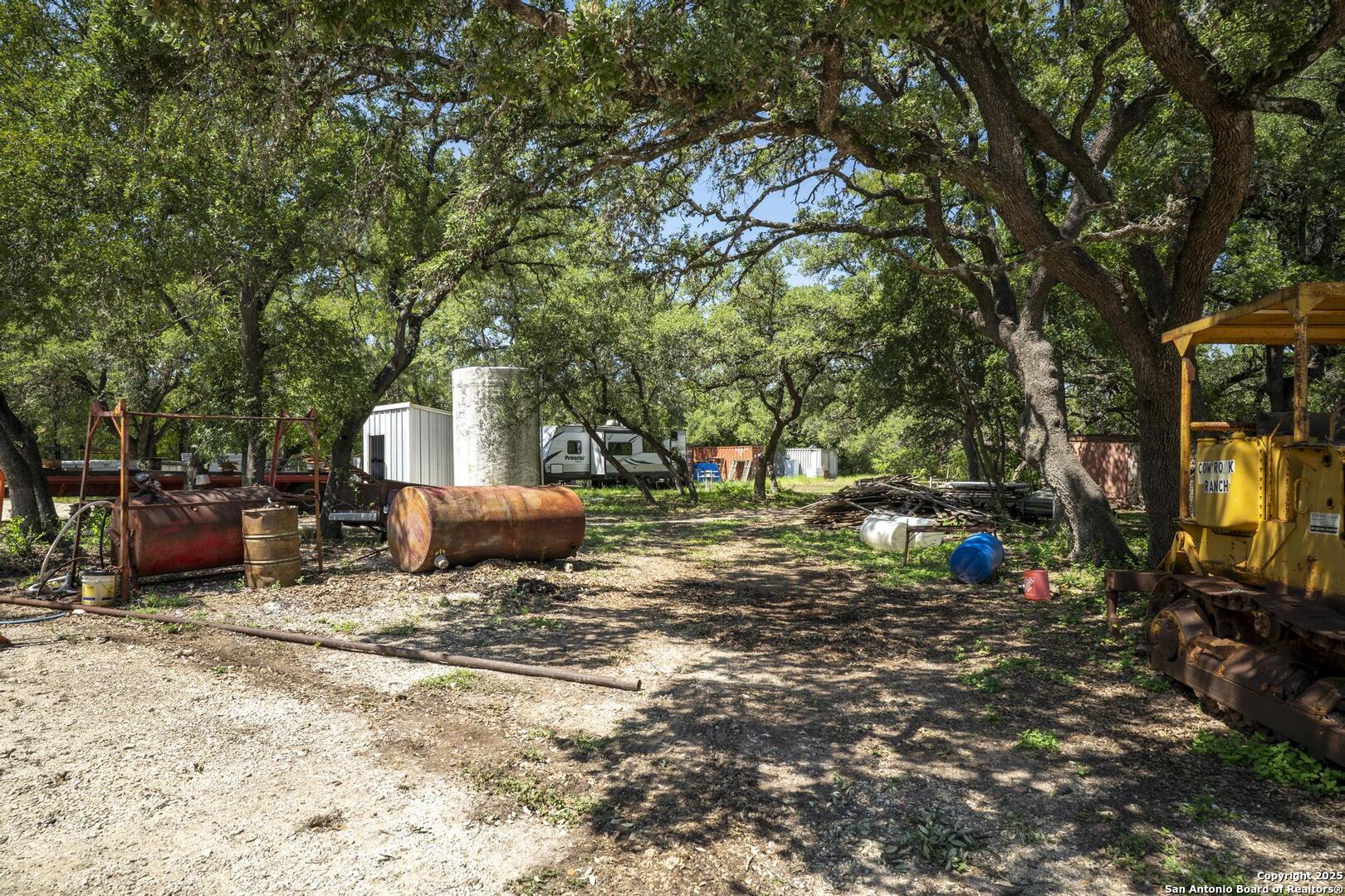 10855 Jericho Road Helotes, TX 78023 - Photo 56 of 59 a backyard of a house with table and chairs