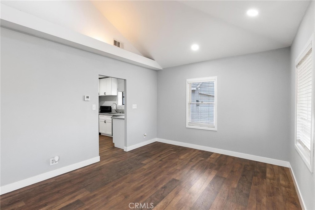 34789 Wildwood Canyon Road Yucaipa, CA 92399 - Photo 13 of 52 a view of a kitchen with wooden floor and a refrigerator