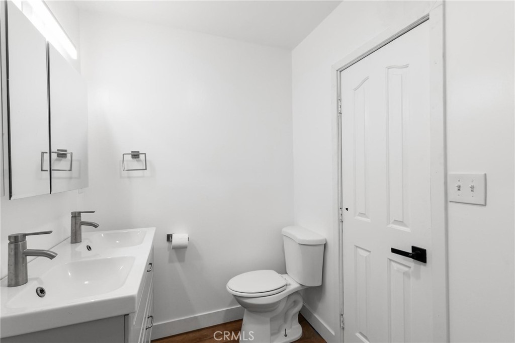 34789 Wildwood Canyon Road Yucaipa, CA 92399 - Photo 21 of 52 a bathroom with a sink toilet and a mirror