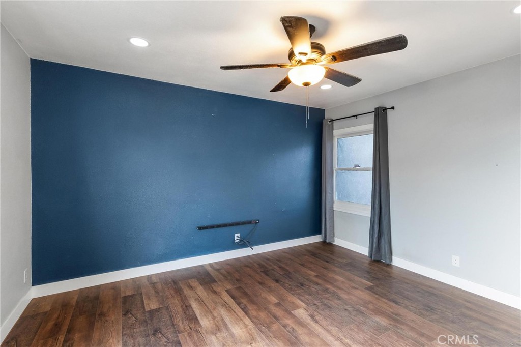 34789 Wildwood Canyon Road Yucaipa, CA 92399 - Photo 27 of 52 wooden floor in an empty room with a window